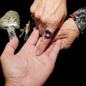 Palm reading session with crystal accessories