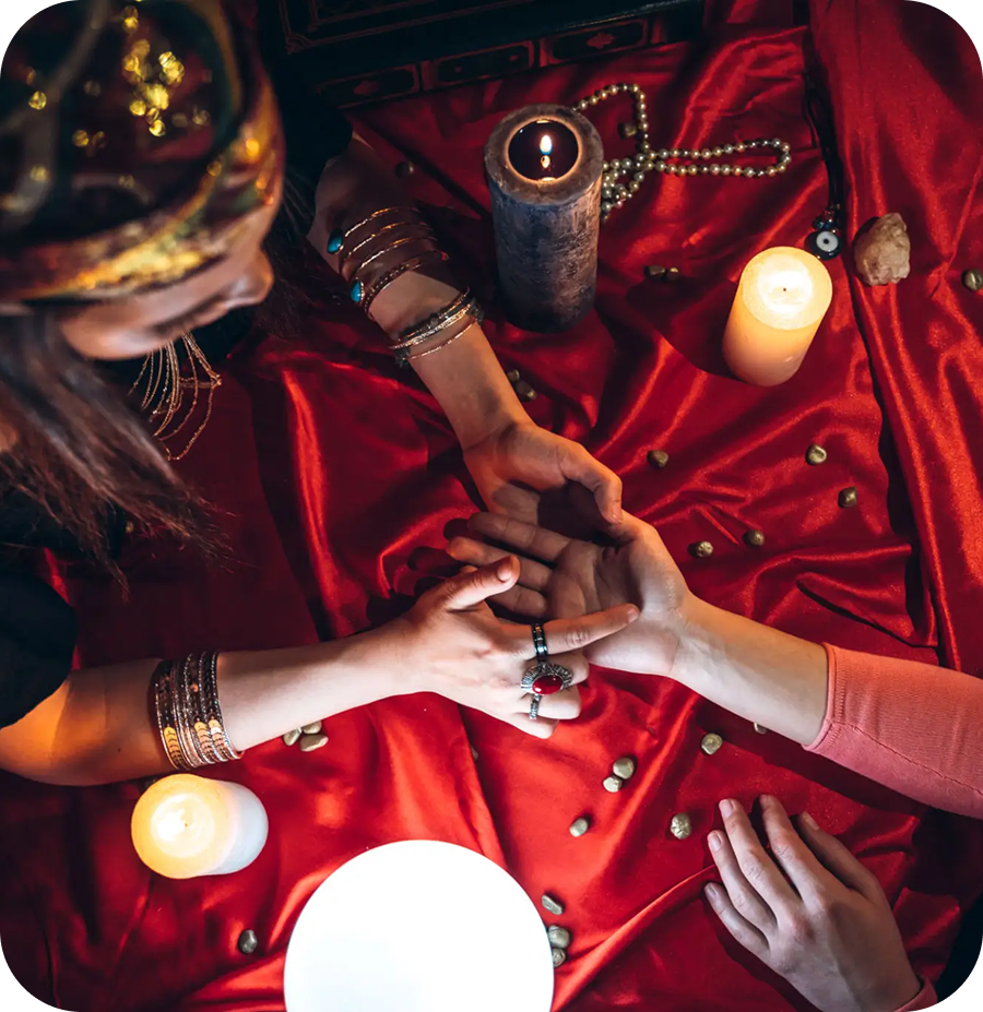 Mystic scene with candles and hands